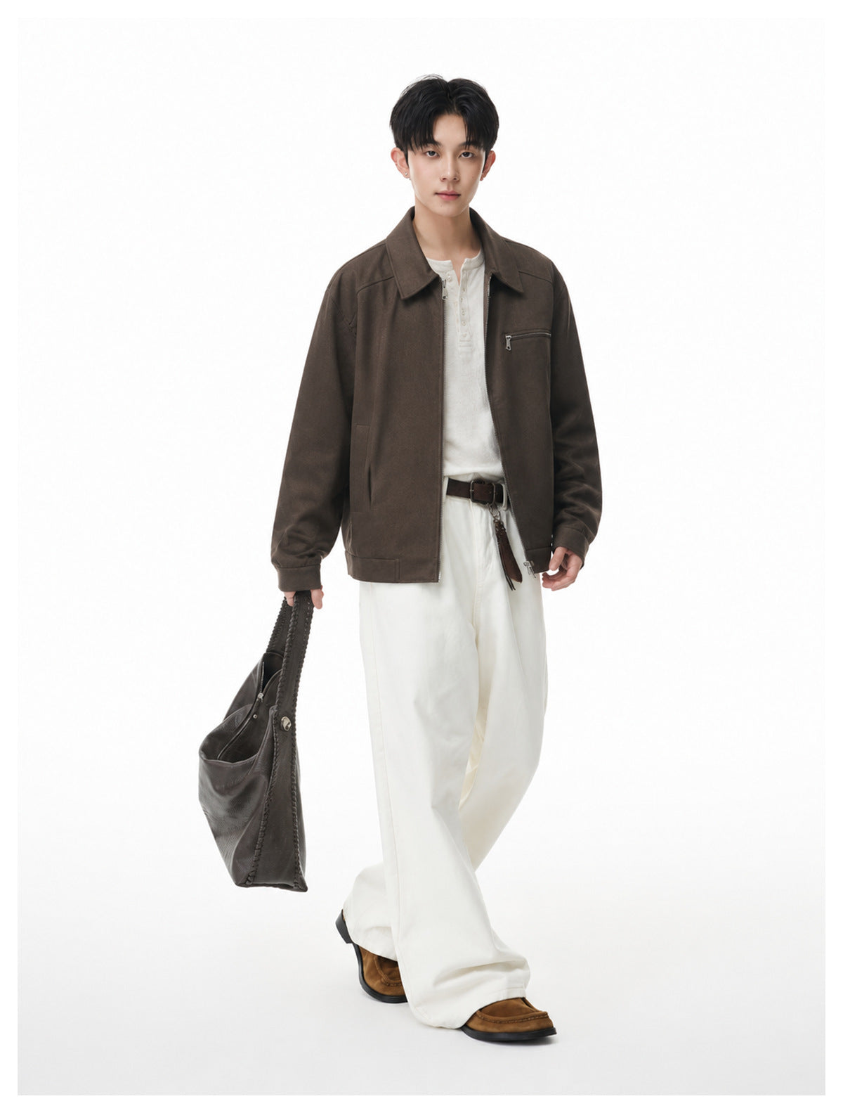 Full-length view of a model wearing a dark brown collared zip jacket with a chest zip pocket.