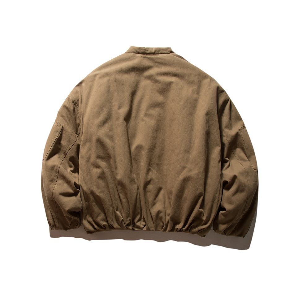 Back view of khaki-brown bomber-style jacket with gathered hem and cuffs and sleeve pockets