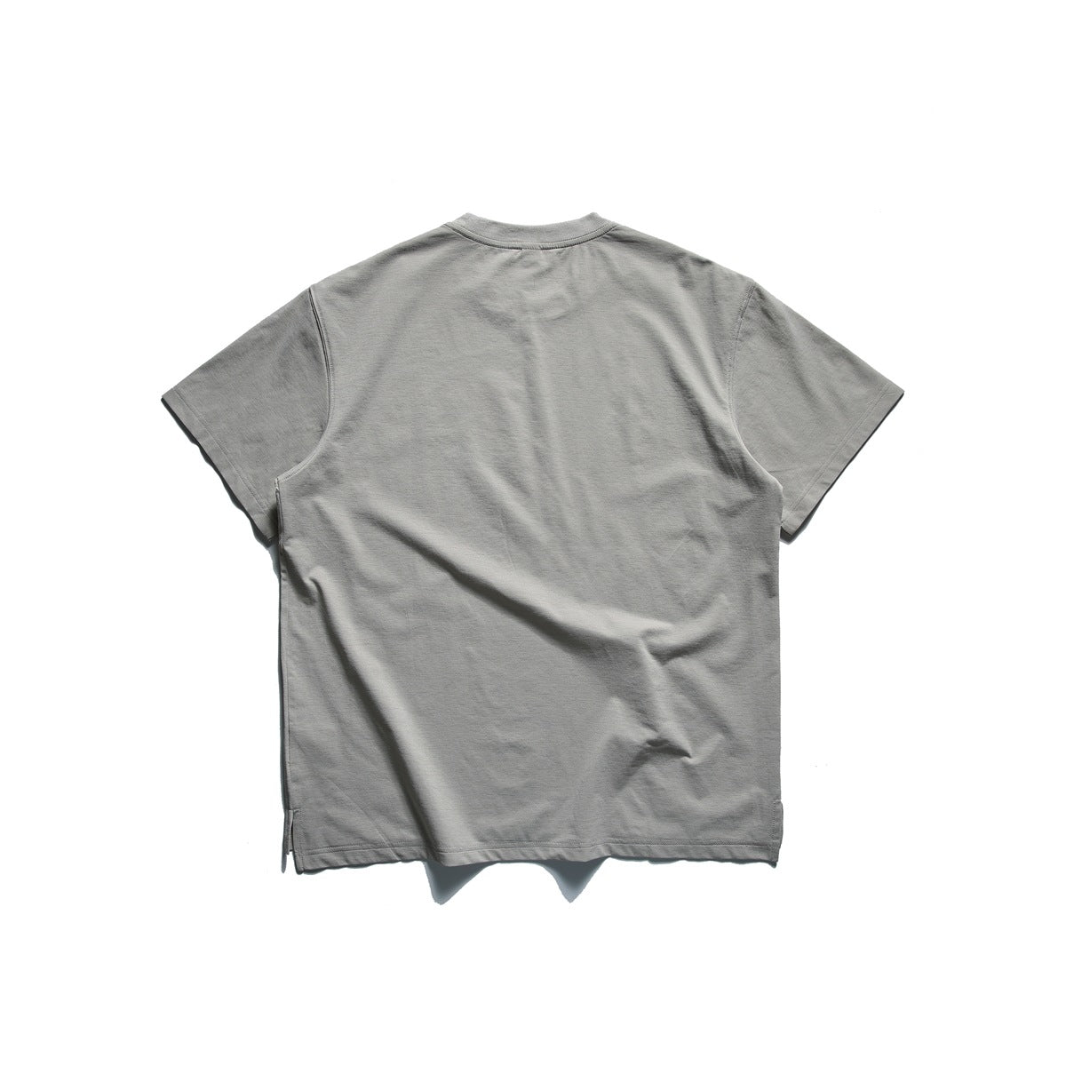 Back view of a plain light gray short-sleeve crew-neck T-shirt on a white background.