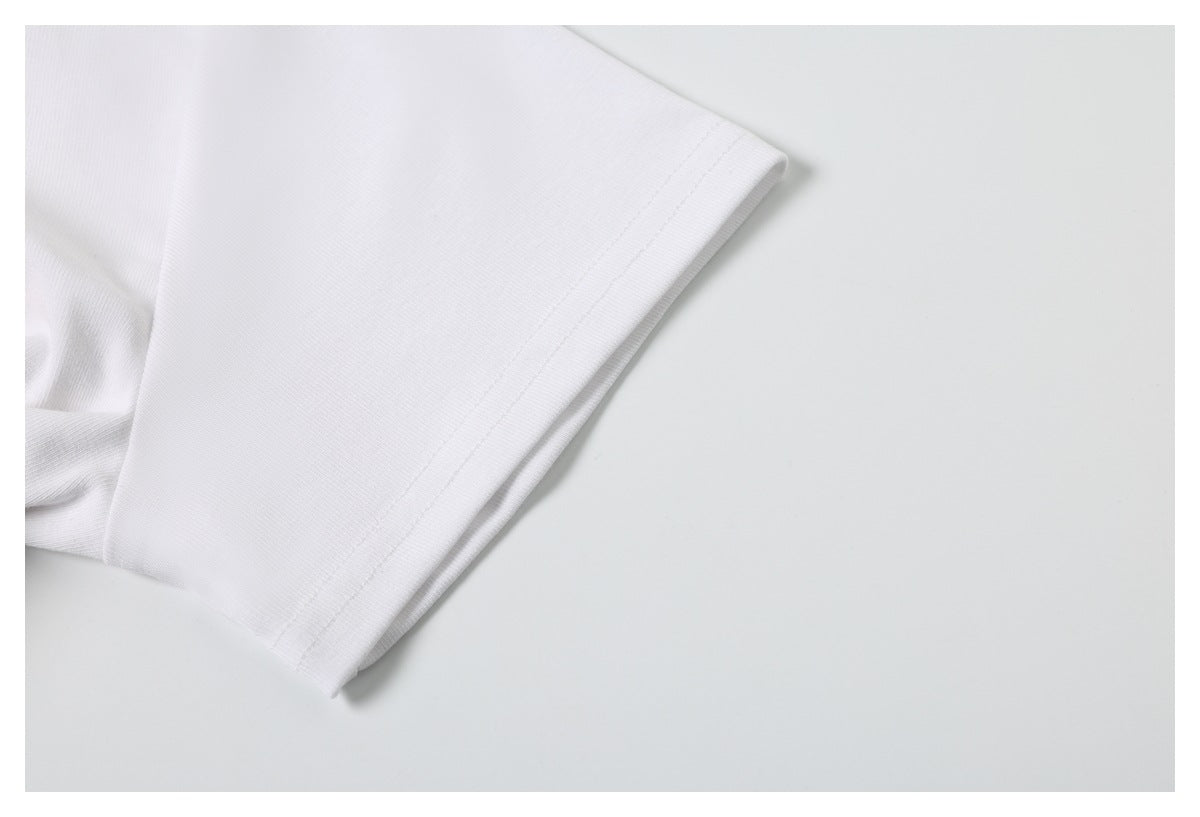 Close-up of the plain white T-shirt sleeve and stitched sleeve hem.