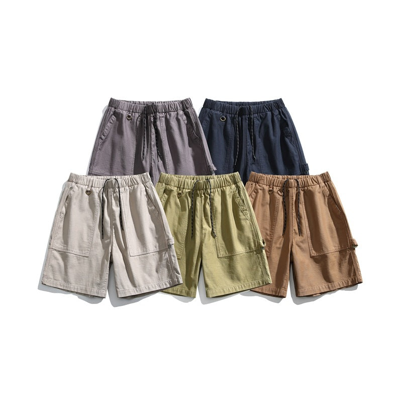 Five pairs of elastic-waist cargo shorts arranged together in gray, navy, off-white, olive, and brown.