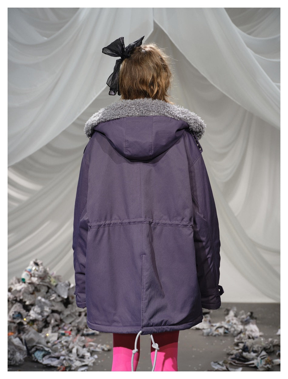 Back view of a plum parka with a gray textured collar, hood, and adjustable drawcord hem, worn by a model.
