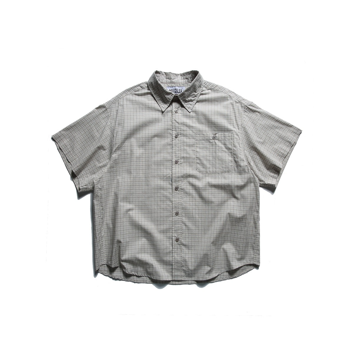 Beige small-check short-sleeve button-up shirt laid flat, front view with chest pocket and pointed collar