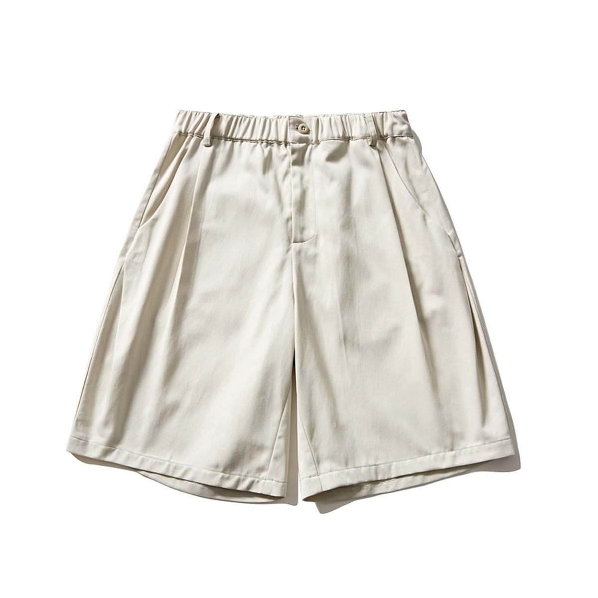 Off-white pleated wide-leg knee-length shorts with elastic waistband and button, front flat lay
