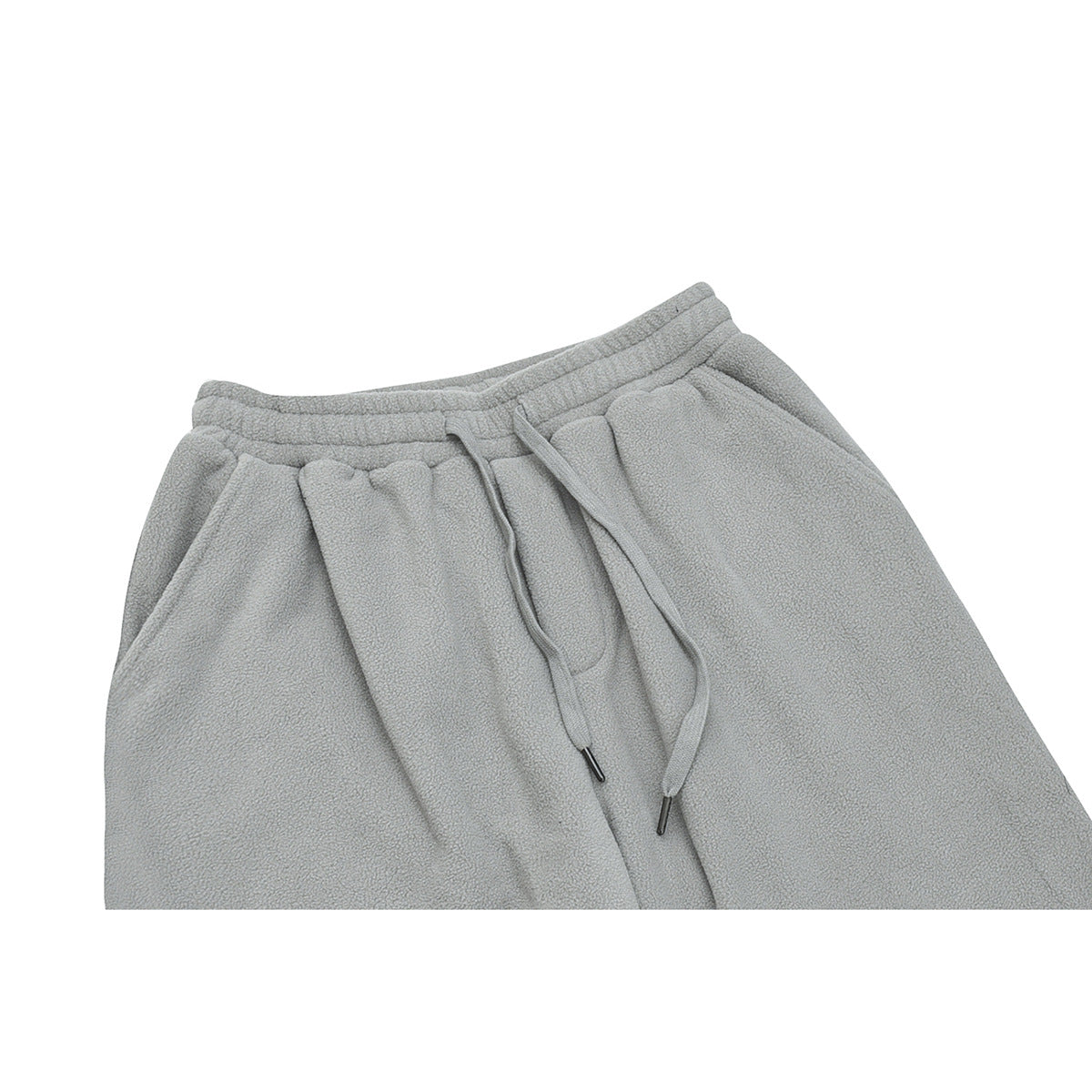 Close-up of light gray fleece pants showing the elastic waist, drawstrings, and front pockets.