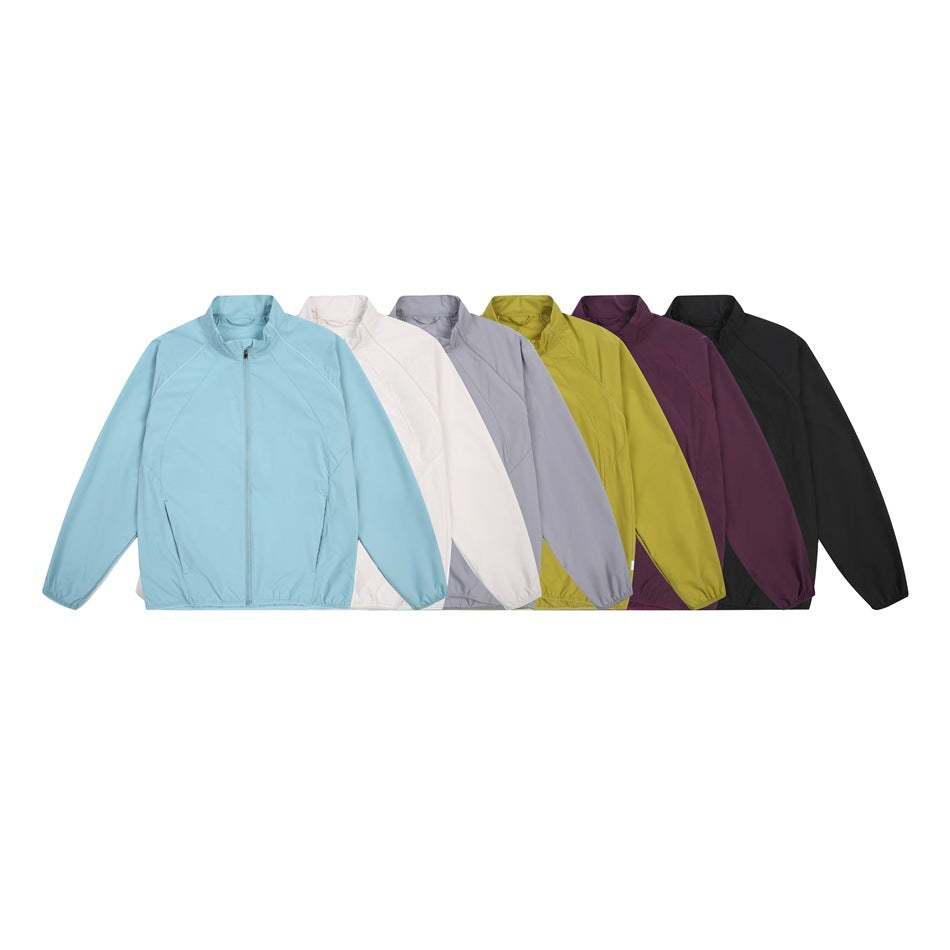 Six zip jackets displayed together in light blue, white, gray, chartreuse, plum, and black.