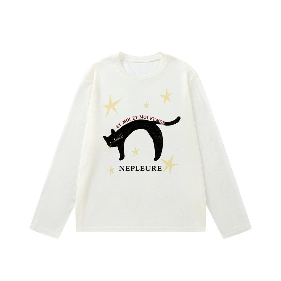 Off-white long-sleeve crew-neck top with black arched cat, cream stars and NEPLEURE print on the front
