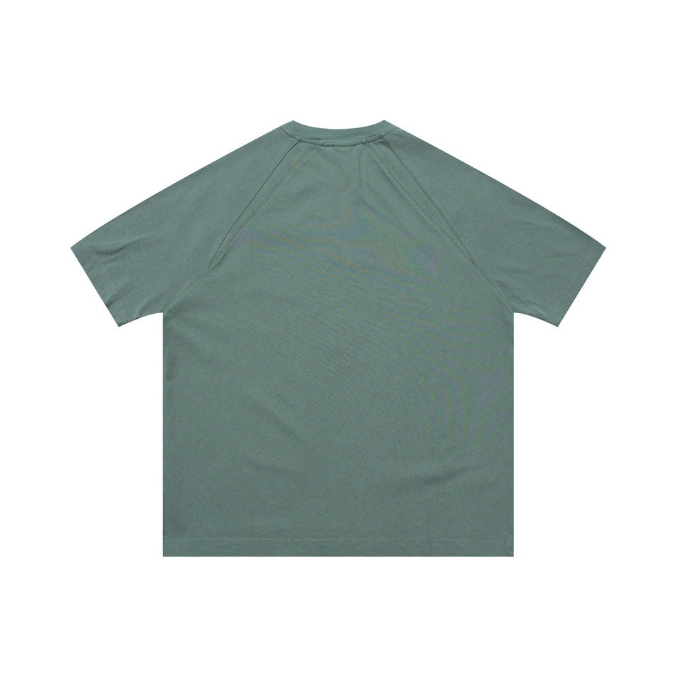 Back view of a sage green short-sleeve raglan crew-neck shirt laid flat.