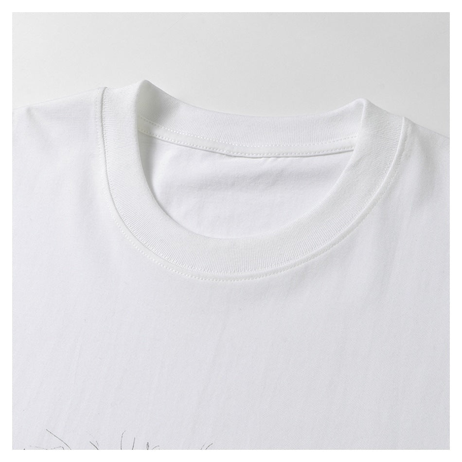 Close-up of a white T-shirt's ribbed crew neckline and shoulder seams, framed by a white border.