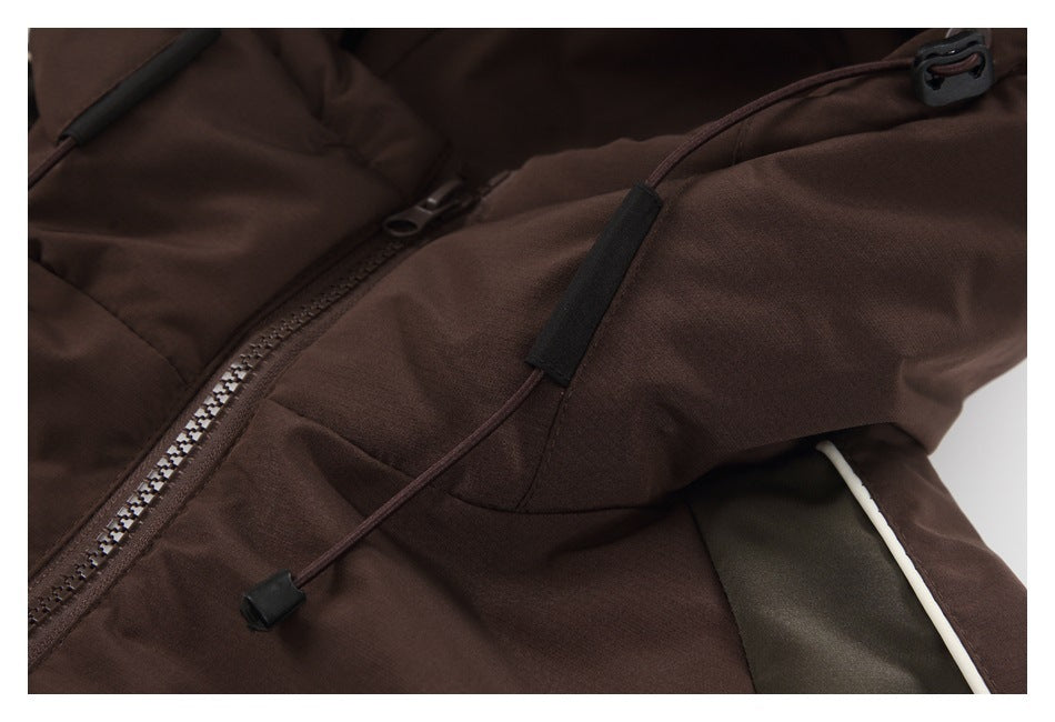 Close-up of a dark brown jacket front zipper and adjustable drawcord with black fittings.