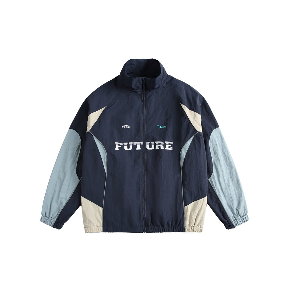 Navy track-style jacket with light blue sleeves, cream panels and white FUTURE chest print, front view