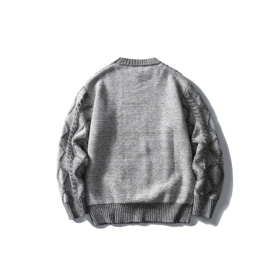 Back view of gray knit sweater with plain back and diamond cable-knit sleeves