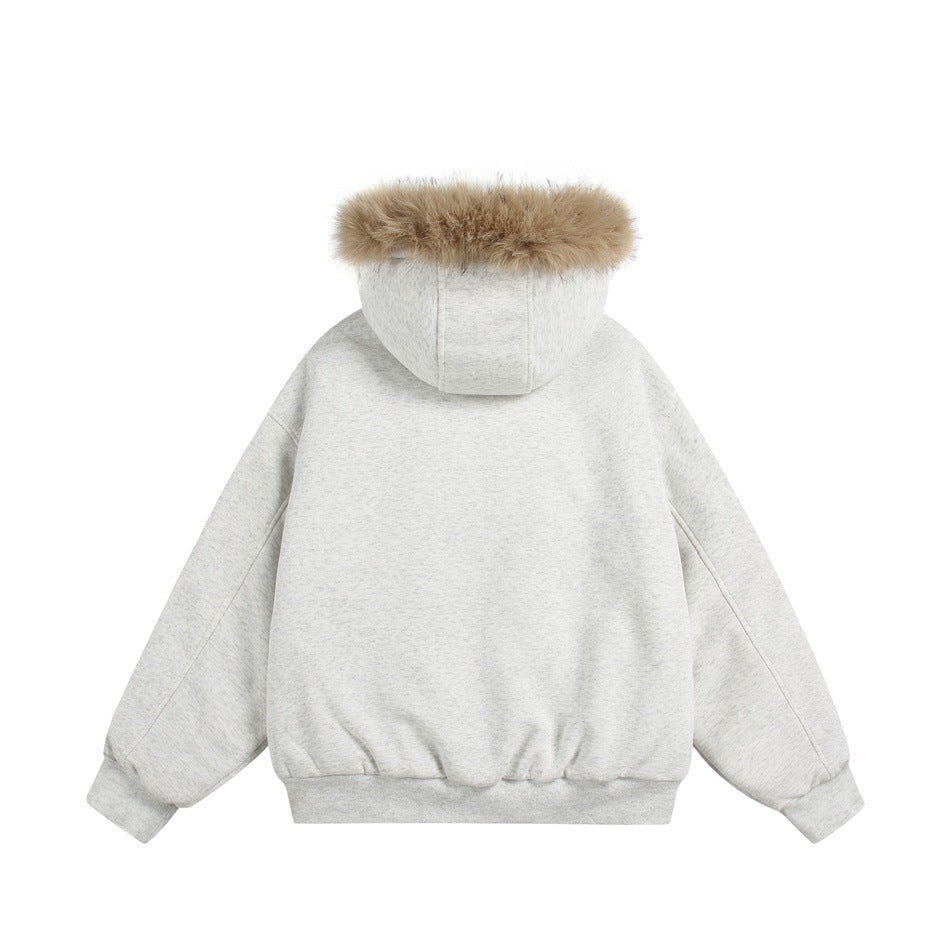 Back view of a light gray hooded jacket with tan fur trim, long sleeves, and a ribbed hem.