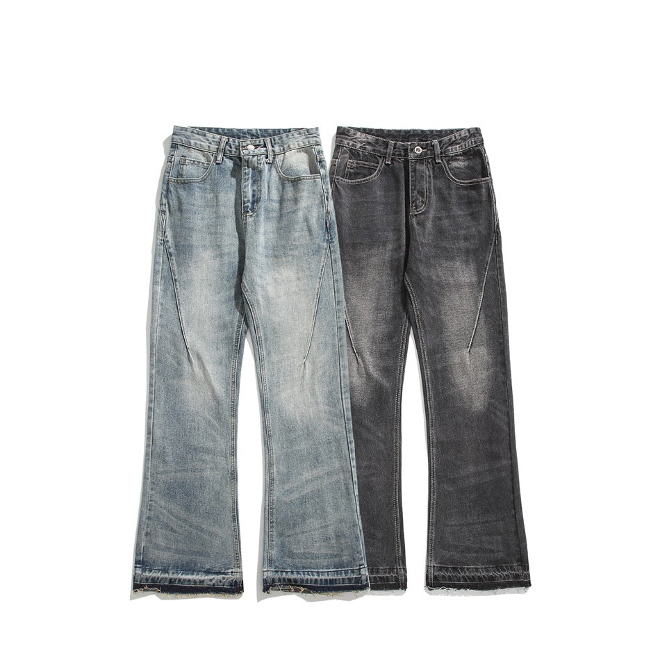 Two pairs of flared jeans shown from the front: one light blue wash and one charcoal gray wash.