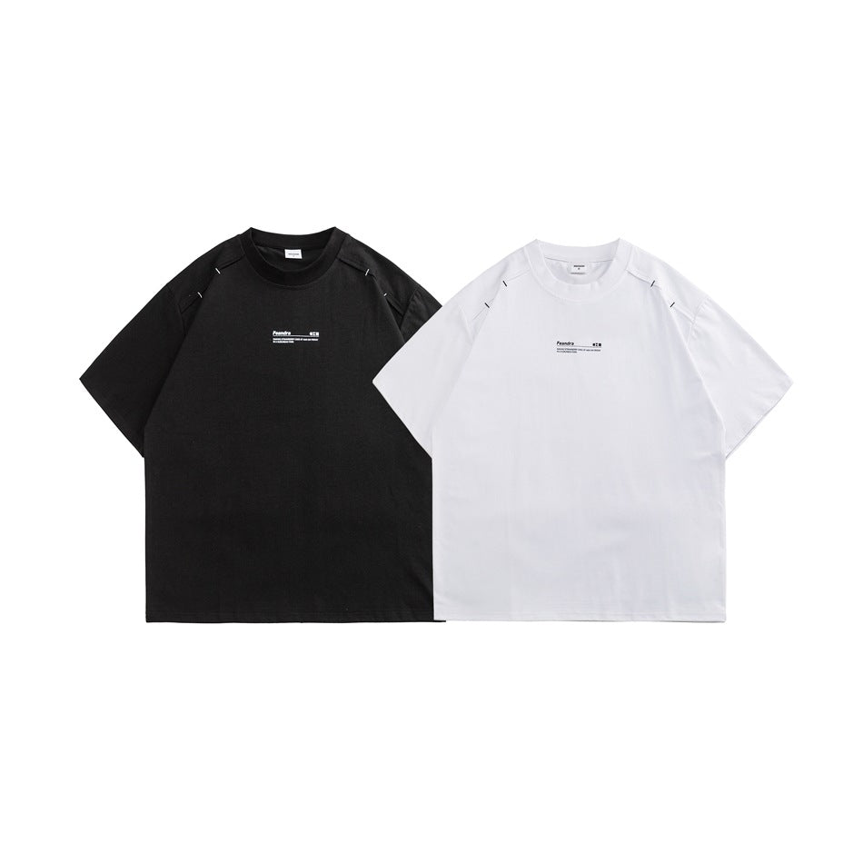 Front view of black and white short-sleeve crew-neck T-shirts with small chest prints and shoulder details.