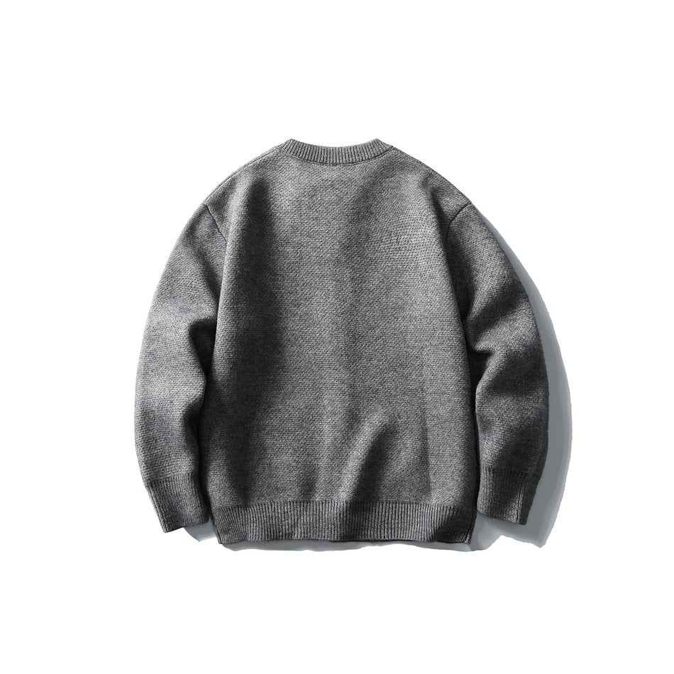Back view of a gray long-sleeve knit sweater with a round neckline and ribbed cuffs and hem.
