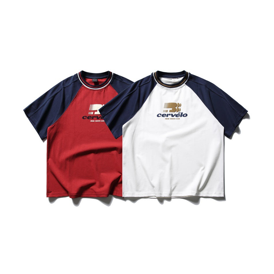 Two short-sleeve raglan T-shirts shown from the front: red with navy sleeves and white with navy sleeves, both with chest