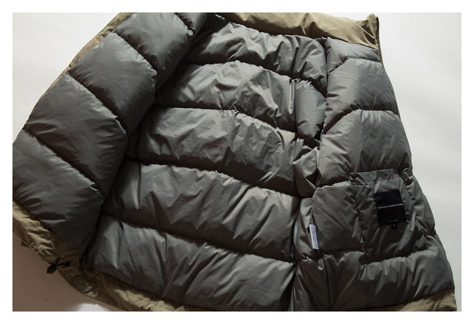 Open olive jacket showing its dark gray quilted lining and a sewn black label.