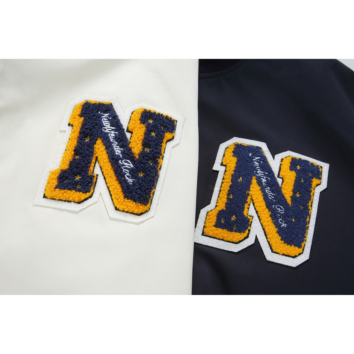 Close-up of textured varsity-style N patches in navy, yellow, and white on cream and navy fabric.