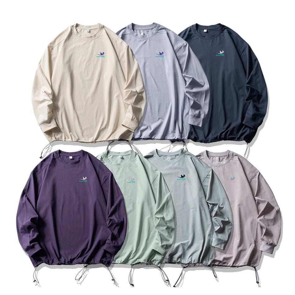 Seven long-sleeve shirts with drawcord hems shown front-facing in ivory, lavender, navy, purple, mint, pale blue-gray, and
