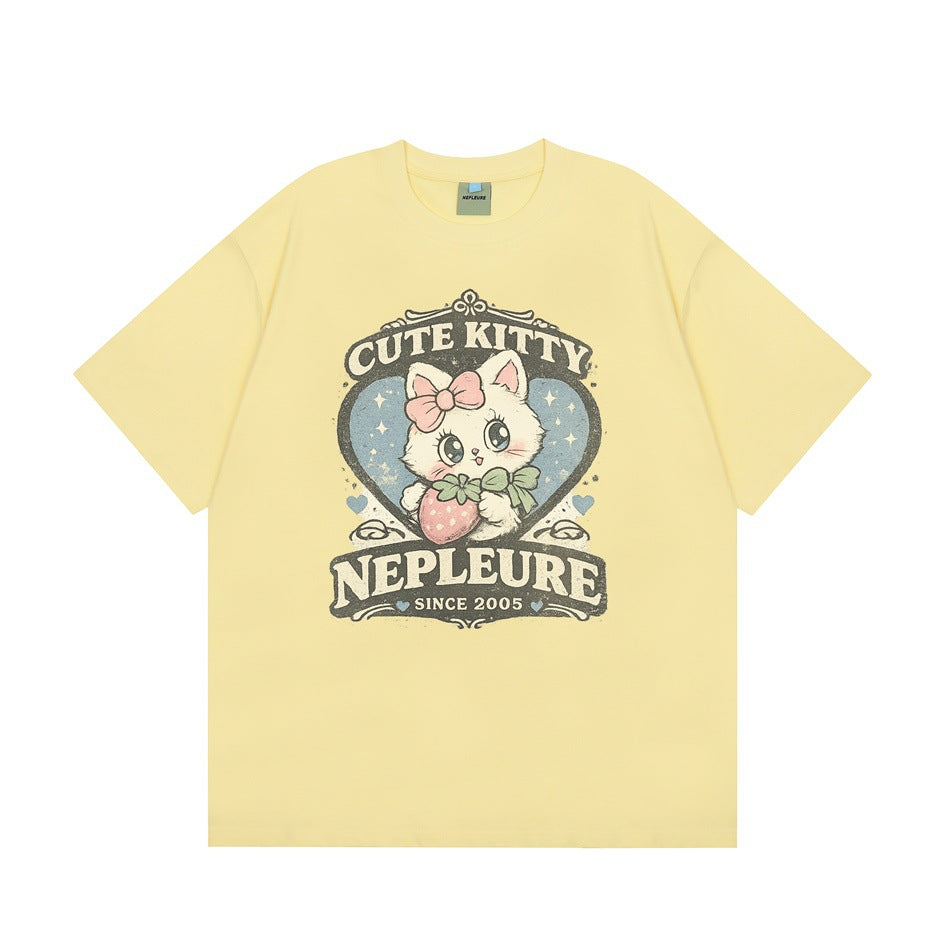 Light yellow short-sleeve crew-neck T-shirt with a cartoon kitten and strawberry heart graphic on the front