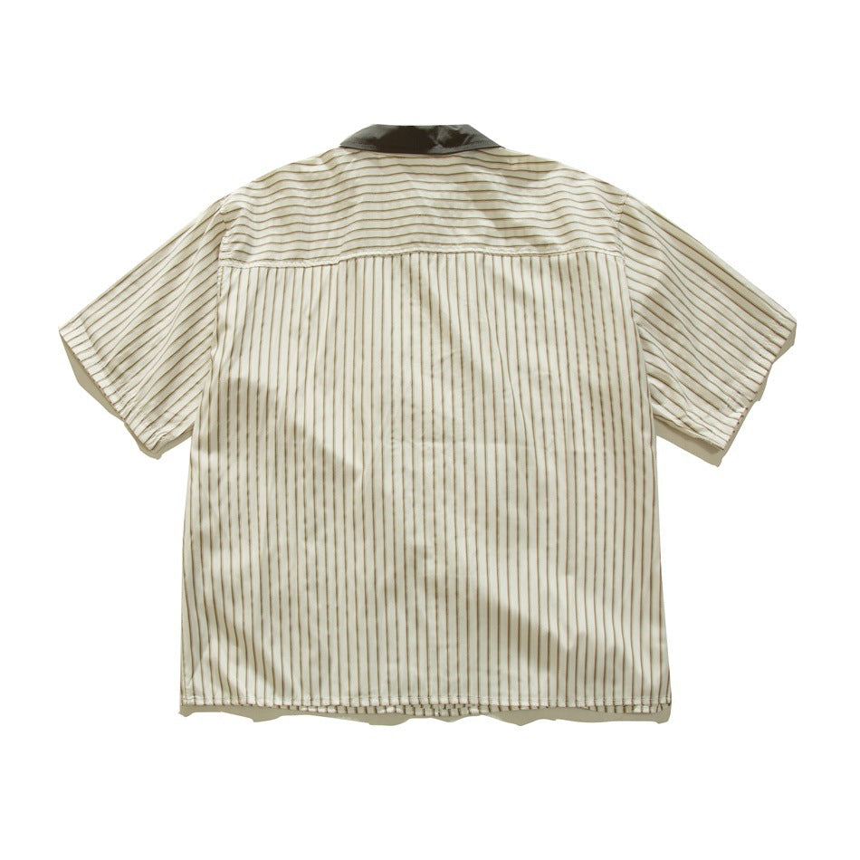 Back of cream striped short-sleeve shirt with horizontal-striped yoke, vertical stripes below and dark olive collar
