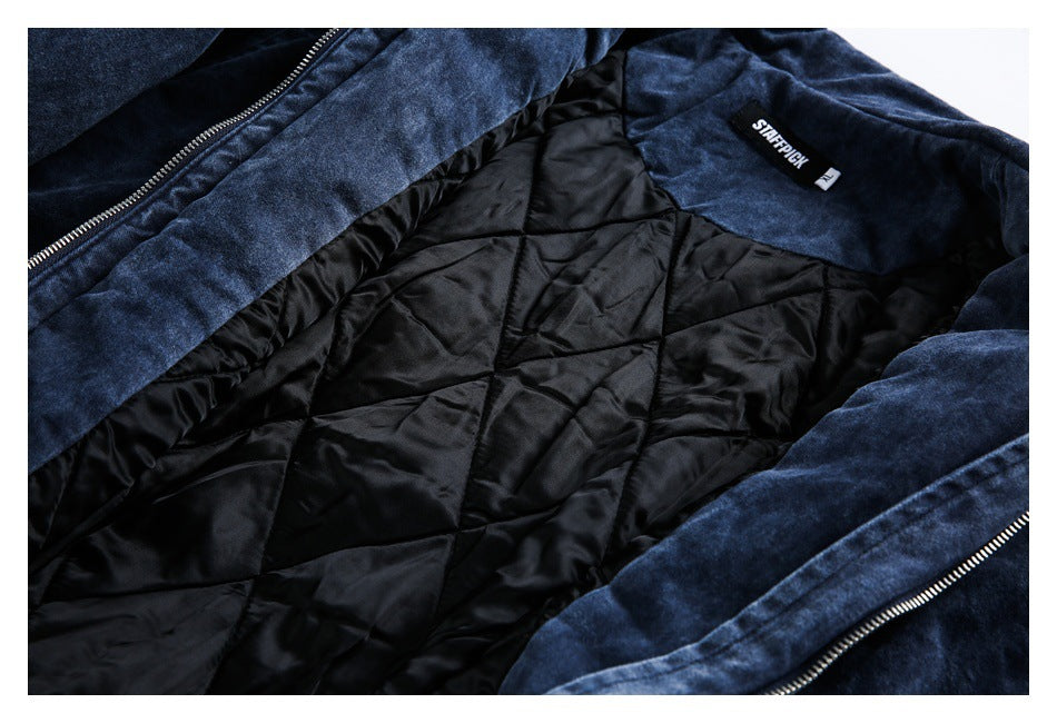 Open dark blue jacket showing its black quilted lining, zipper and sewn-in neck label.
