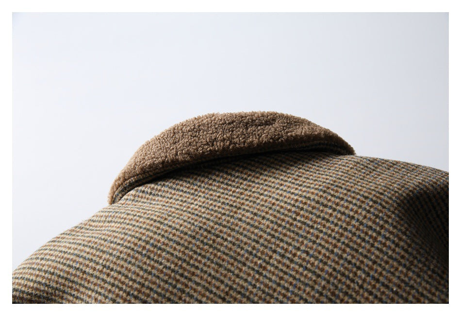 Close-up of a brown and tan checked garment collar with a textured brown edge.