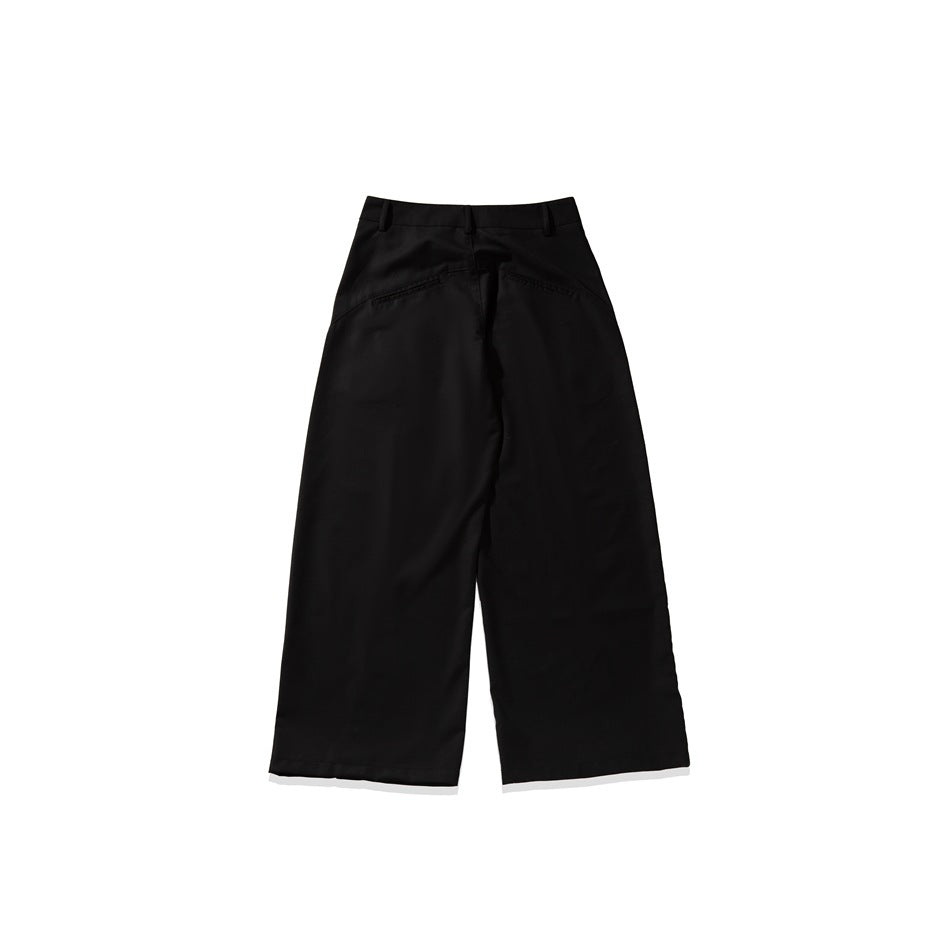 Back view of black wide-leg trousers with belt loops and two welt pockets, isolated on white.