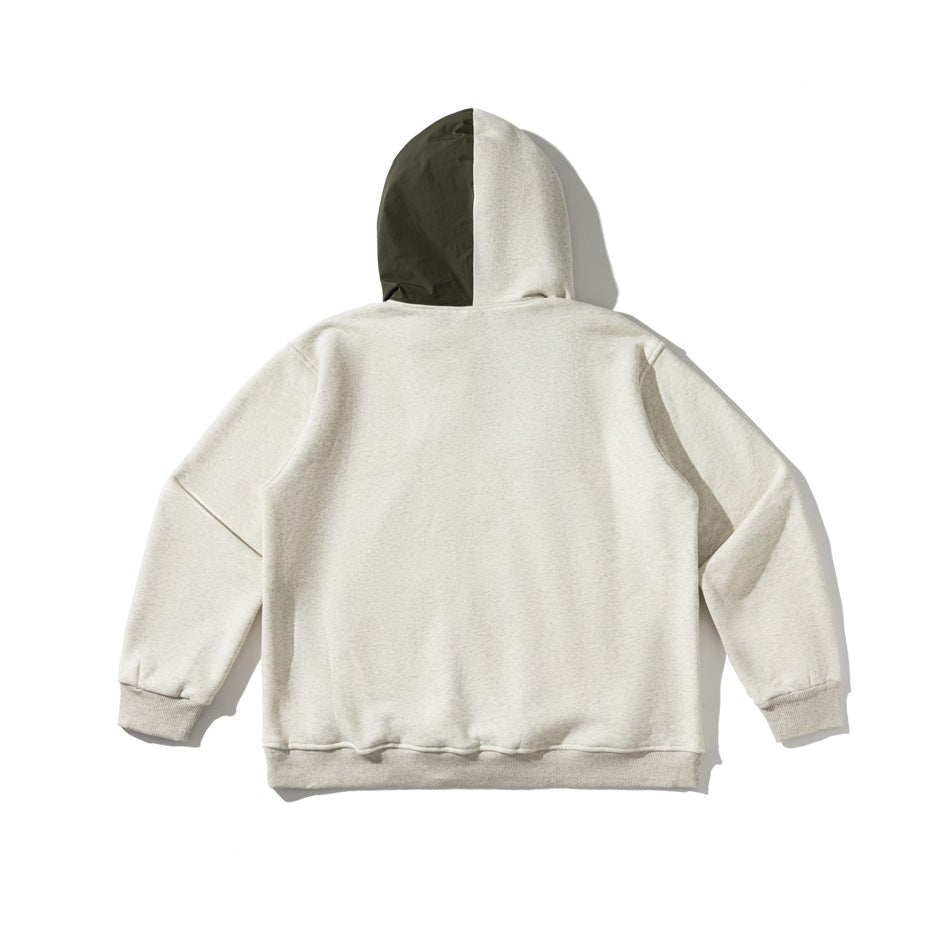 Back view of an off-white hoodie with an olive and cream two-tone hood, ribbed cuffs, and hem.