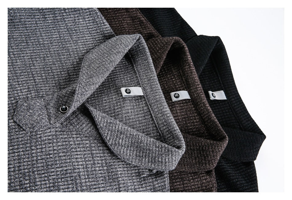 Close-up of three textured polo collars in gray, dark brown, and black, with small collar labels and buttons.