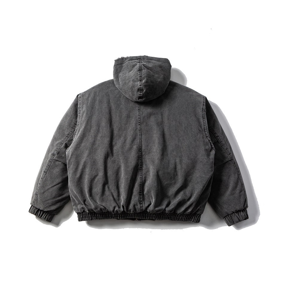 Back view of a dark charcoal hooded jacket with a center seam and elasticated cuffs and hem.