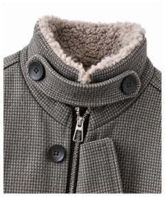 Close-up of the jacket's fleece-lined stand collar, black buttons, and front zipper.