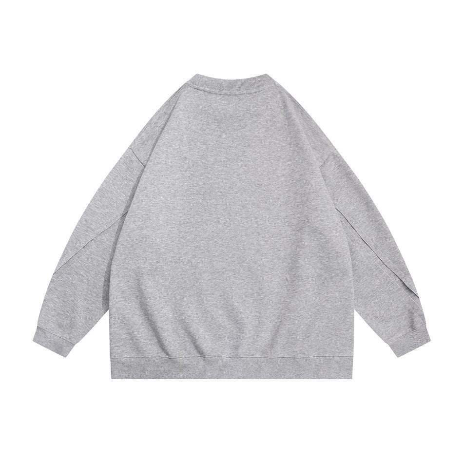 Back view of a light gray crewneck sweatshirt with long sleeves and ribbed cuffs and hem.
