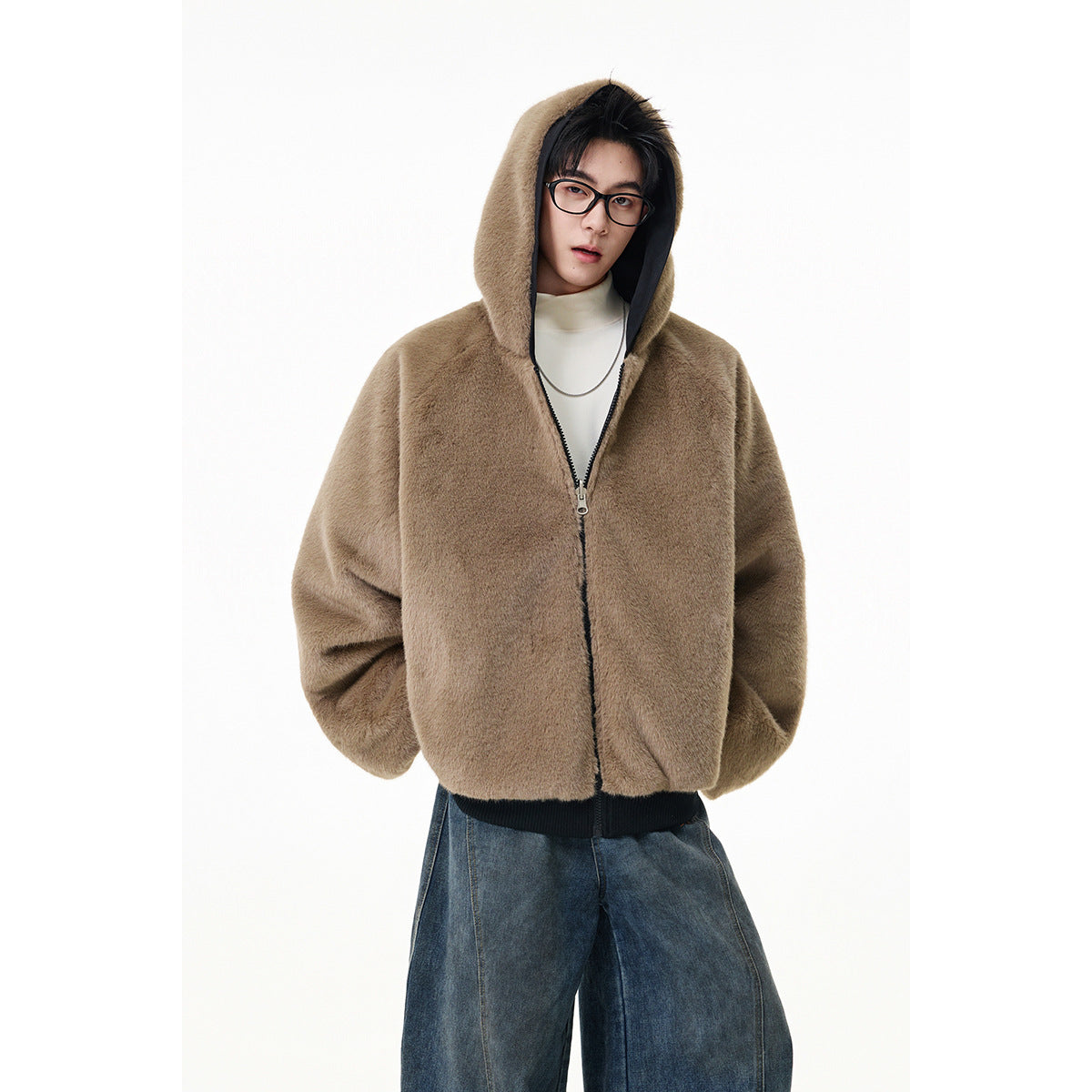 Model wearing a taupe plush hooded zip jacket with dark lining and a dark ribbed hem.
