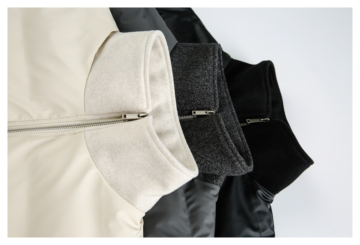 Close-up of three jackets in ivory, charcoal and black, showing contrasting collars and front zippers.