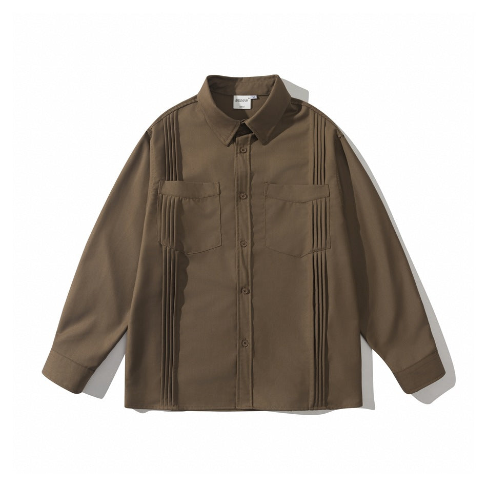 Brown long-sleeve button-front shirt with two flap chest pockets and vertical pintuck pleats, flat lay front view
