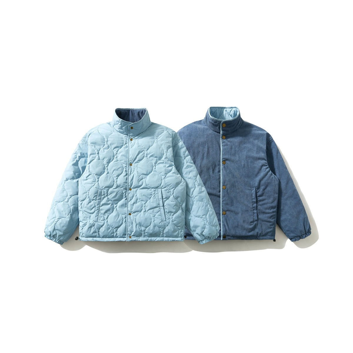 Reversible jacket shown flat, light blue quilted side beside the blue ribbed corduroy-look side