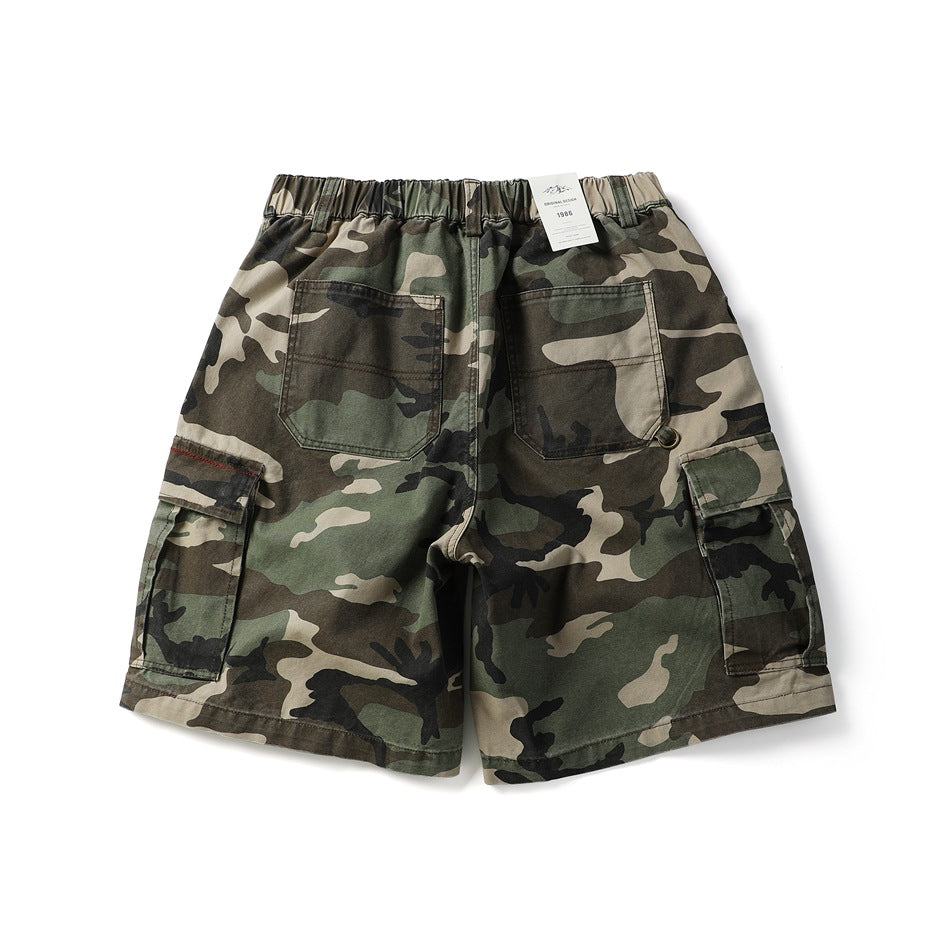 Back view of army green camouflage cargo shorts with two patch pockets, elastic waist and side cargo pockets