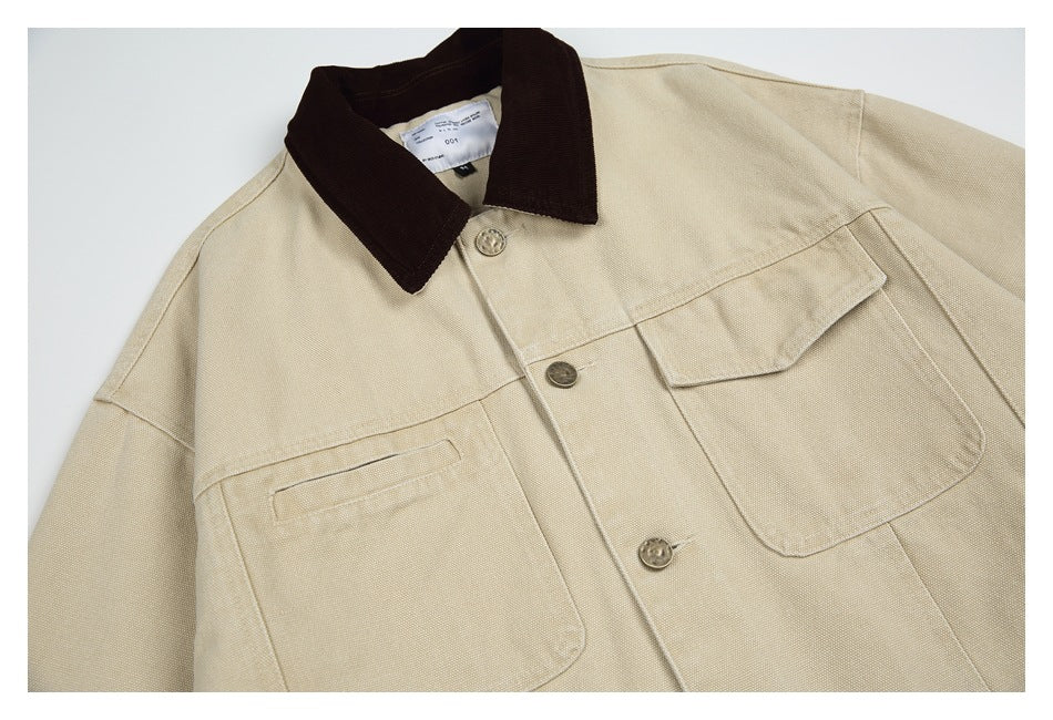 Close view of a beige jacket front with a dark brown collar, button placket, and two large pockets.