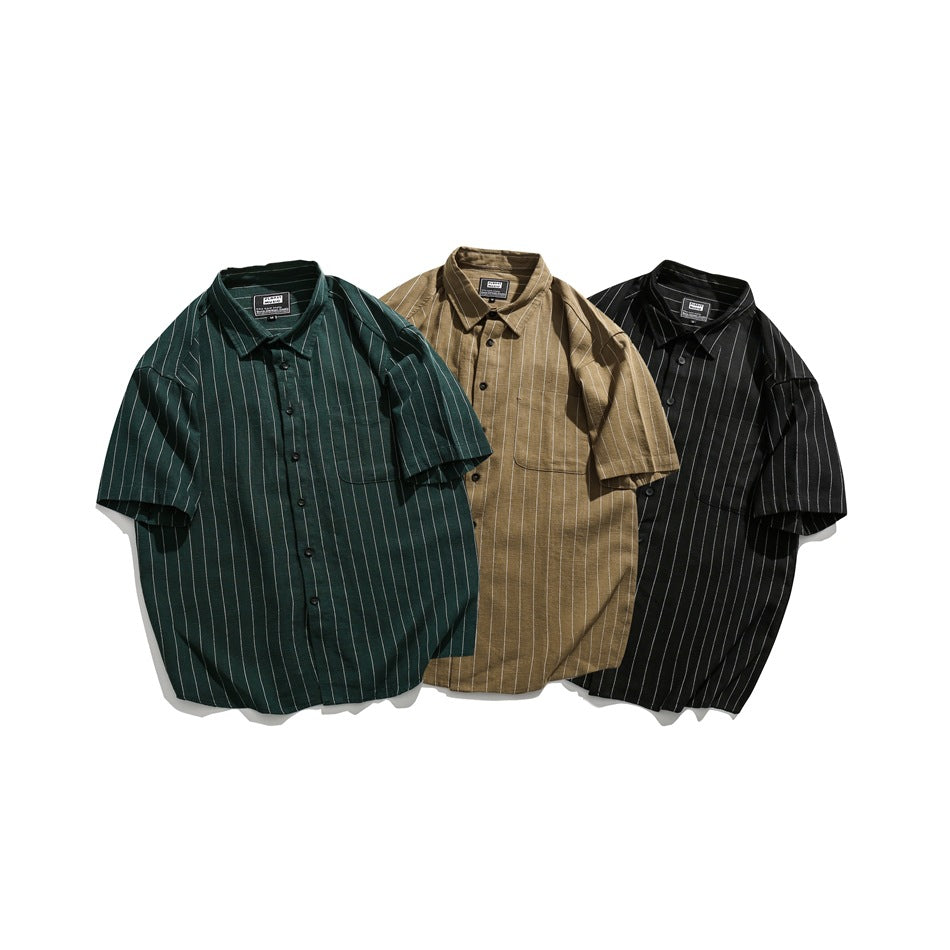 Three short-sleeve button-up shirts in dark green, tan, and black with thin white pinstripes.