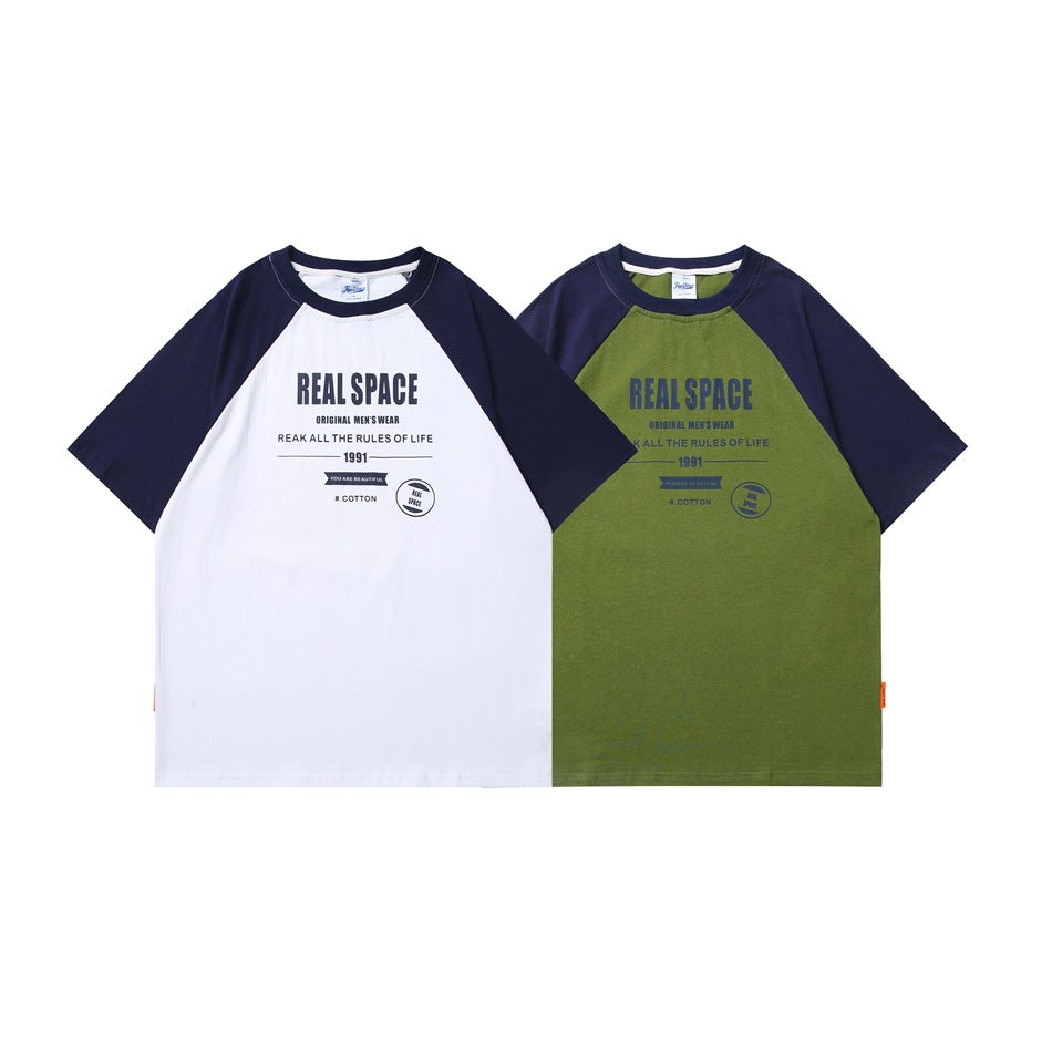 Two raglan T-shirts shown from the front: one white with navy sleeves and one olive green with navy sleeves, both with chest