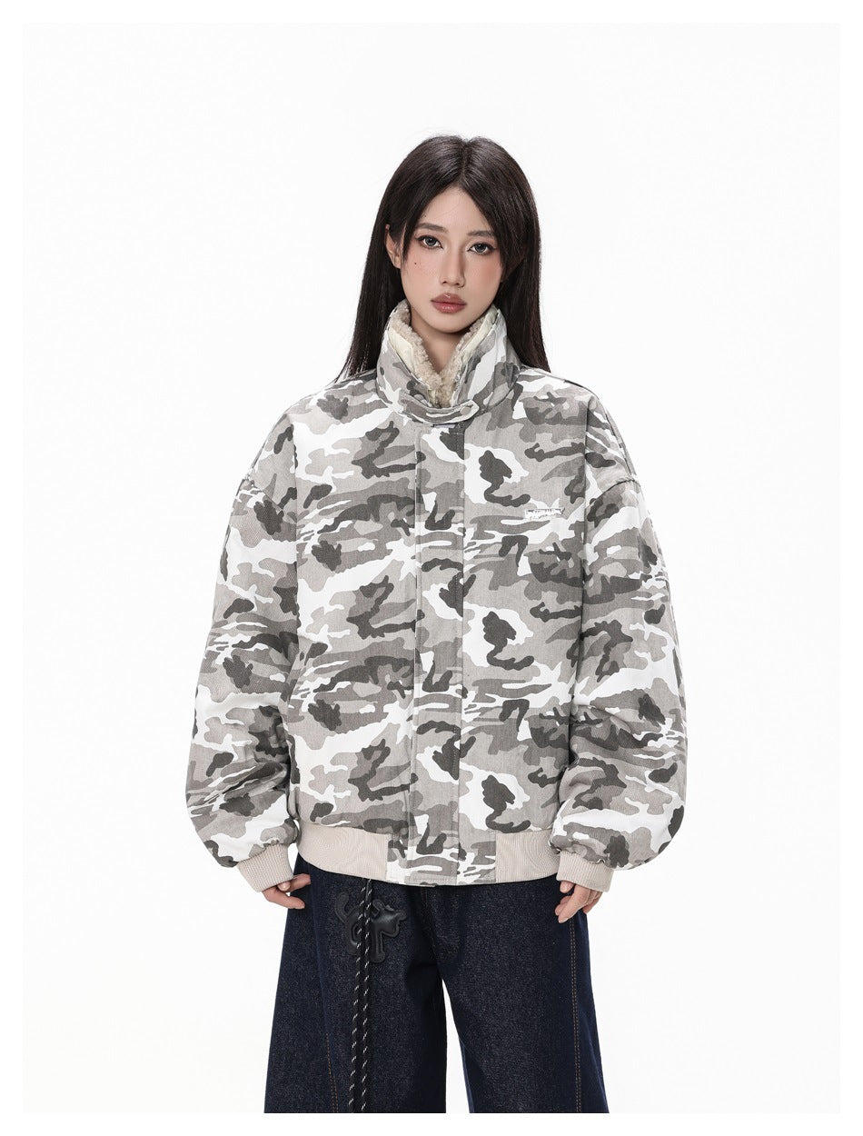 Model wearing a gray-and-white camouflage jacket with a raised fleece-lined collar, front closure, and ribbed cuffs and hem.