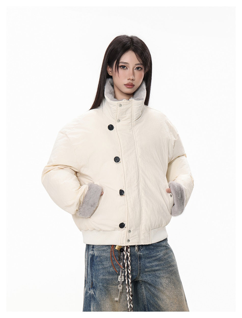 Close front view of an ivory jacket with a high collar, large dark buttons, and gray faux-fur trim.
