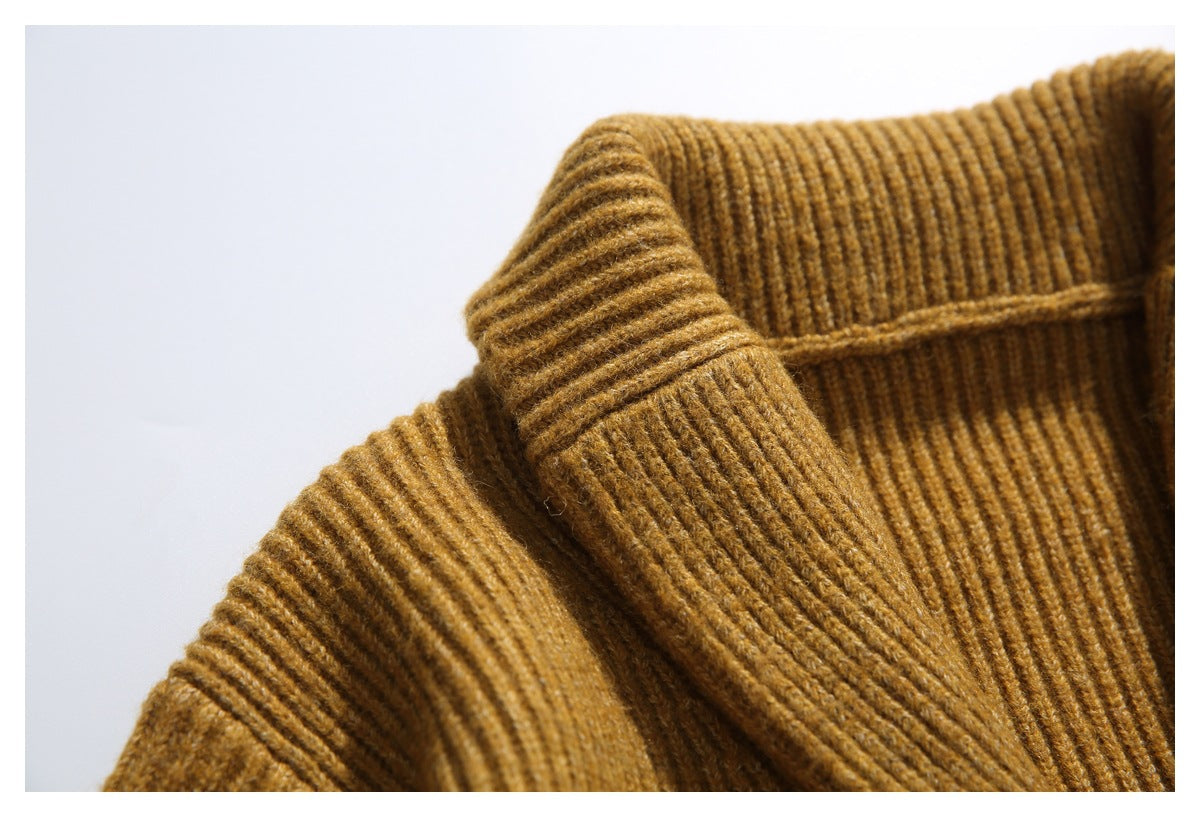 Close-up of the cardigan’s thick ribbed shawl collar and shoulder.