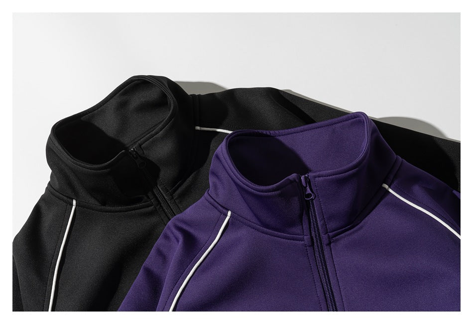 Black and deep purple zip-up jackets with stand collars and white piping, arranged together.