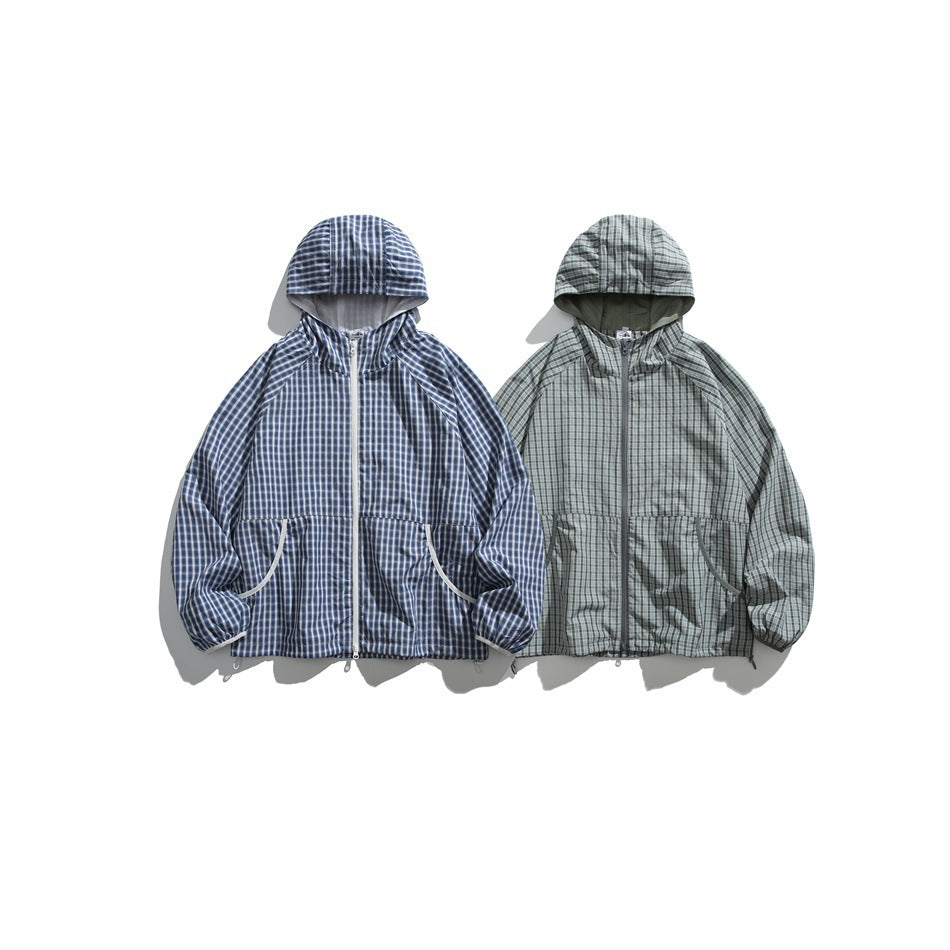 Two hooded plaid jackets displayed front-facing: one navy and white, the other gray-green.