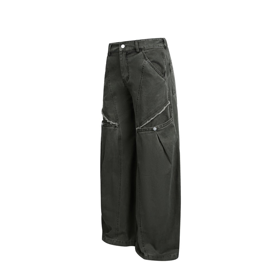 Angled front view of charcoal wide-leg pants showing curved seams, distressed knee openings and silver buttons.