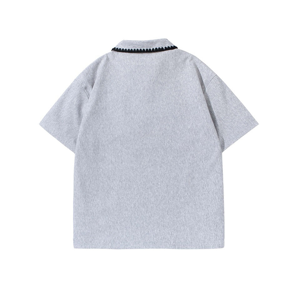 Back view of heather gray short-sleeve polo shirt with black scalloped trim along the collar