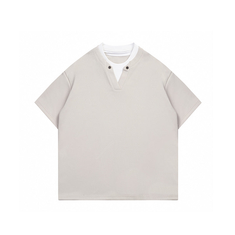 Beige apricot short-sleeve layered-look T-shirt with white inner collar and two-button V-notch neckline, flat front view
